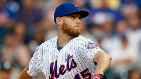 Mets pitcher Zack Wheeler delivers during the first