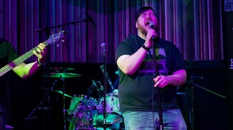 Rich DiLeo, 25, of Seaford sings karaoke backed