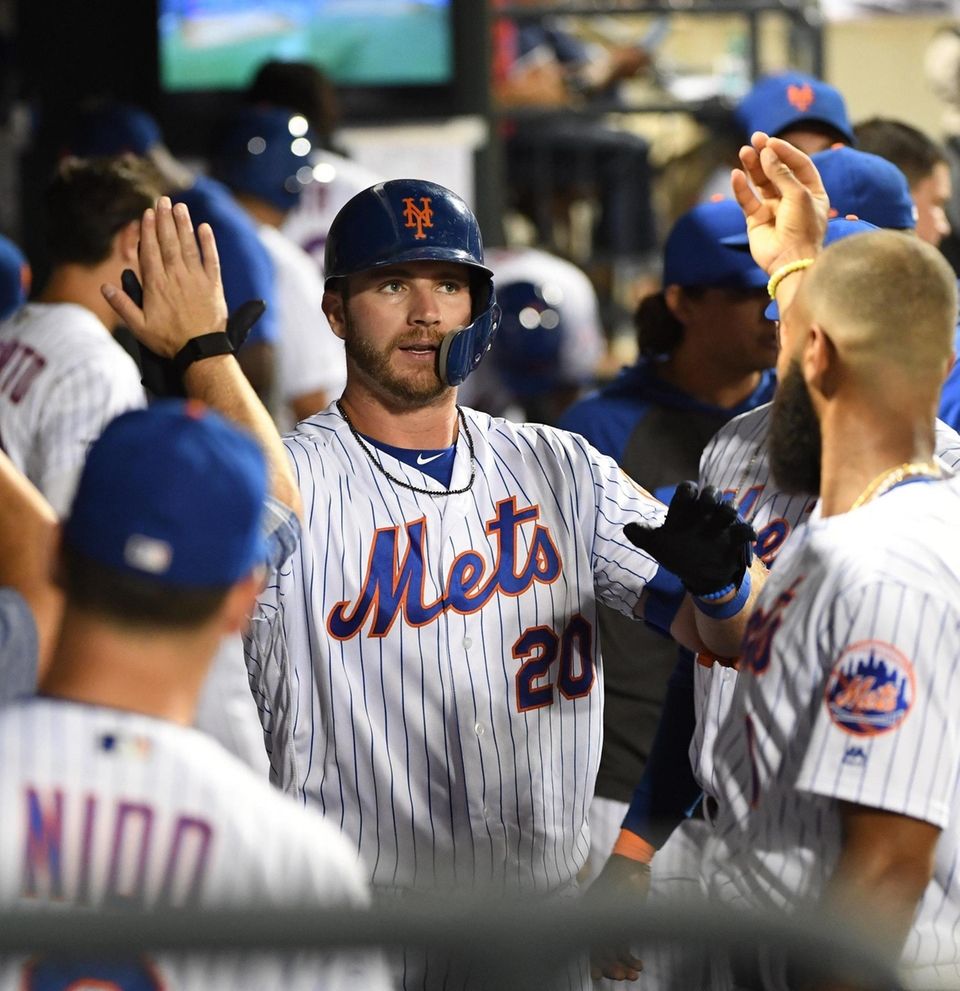 New York Mets' Pete Alonso is greeted in