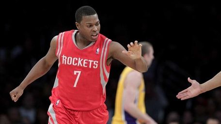 Houston Rockets' Kyle Lowry slaps hands with a