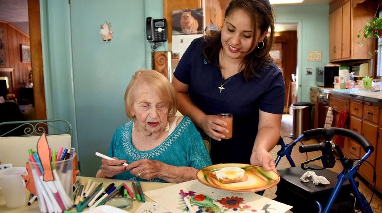 Alma Gonzalez, a home health aide, makes lunch