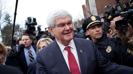 Republican presidential candidate Newt Gingrich greets people outside