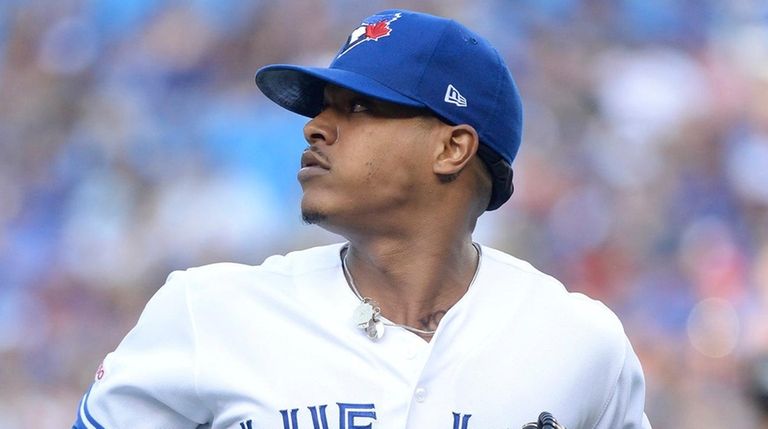 Marcus Stroman looks back as a teammate makes