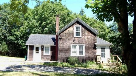 The Calverton property includes a three-bedroom, two-bathroom house