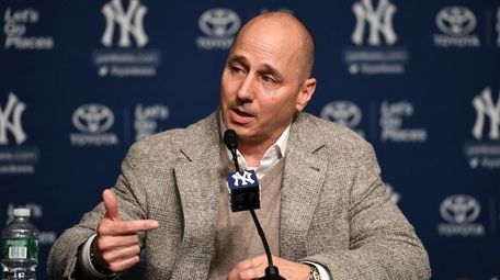 Brian Cashman answers questions during a news conference