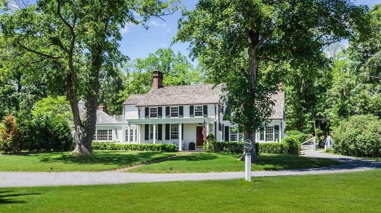 This Lloyd Harbor home has five fireplaces, formal