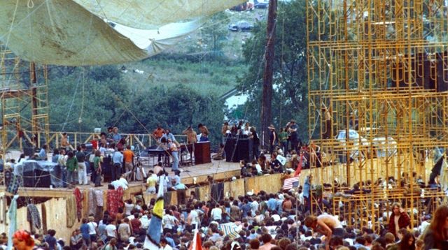 Concertgoers surround the stage as Joe Cocker performs