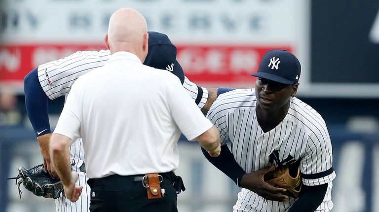 Trainer Steve Donohue checks on Didi Gregorius during