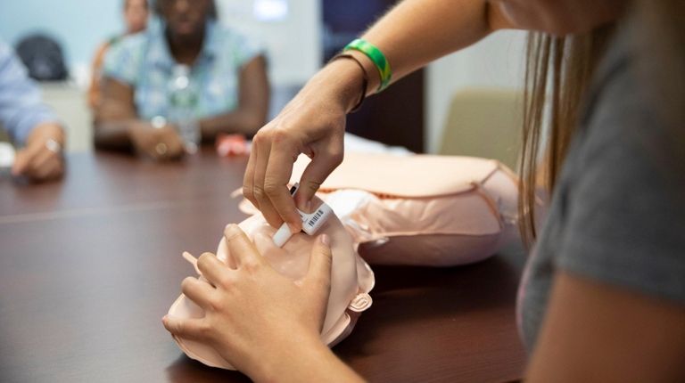 First-year medical students learn how to use a
