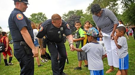 Nassau County Police Officers Eddie Hocton, left, and