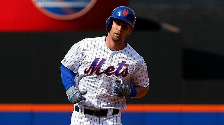 The Mets' Jeff McNeil runs the bases after