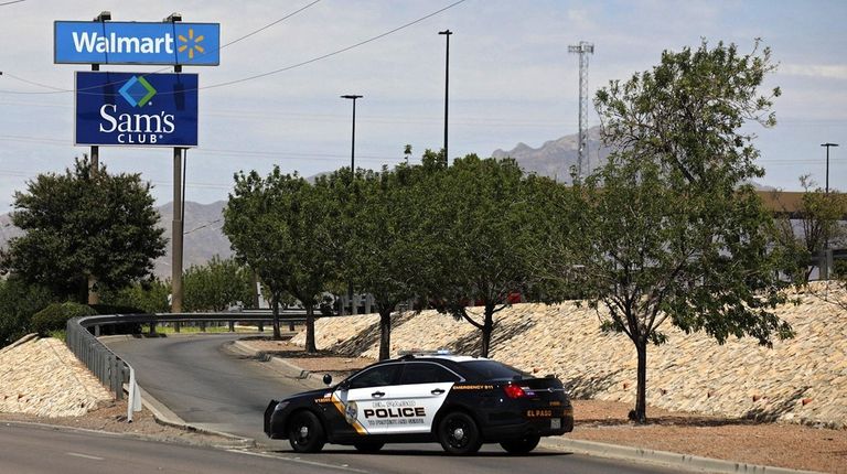 Police block a roadway after the mass shooting