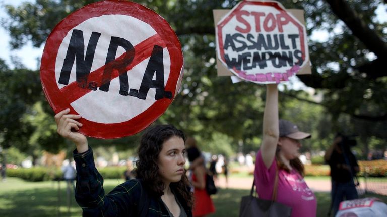 Gun-control activists Tuesday in a park across from