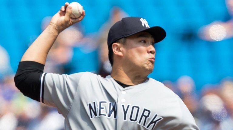 Yankees starting pitcher Masahiro Tanaka delivers against the