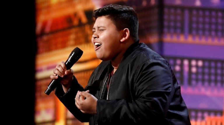 Luke Islam, of Garden City South, performs on