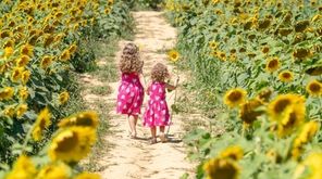 Chloe Robert-Demolaize, 6, from Mattituck and her sister,