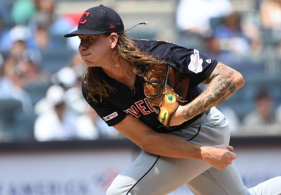 Cleveland Indians starting pitcher Mike Clevinger delivers against