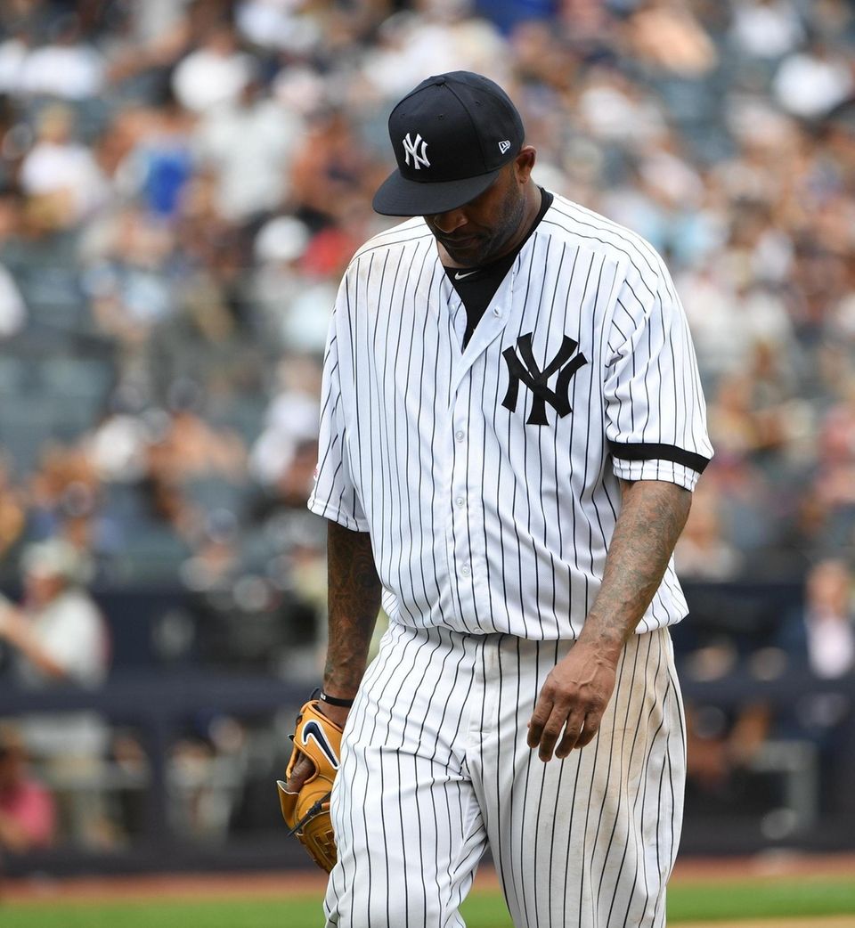 Yankees starting pitcher CC Sabathia walks to the