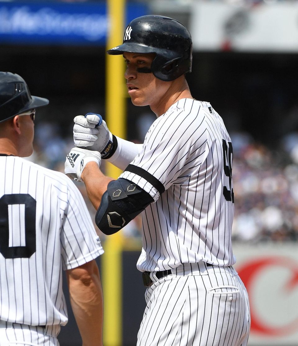 Yankees outfielder Aaron Judge gestures from first base