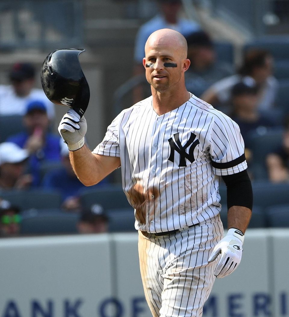 New York Yankees' Brett Gardner removes his batter's