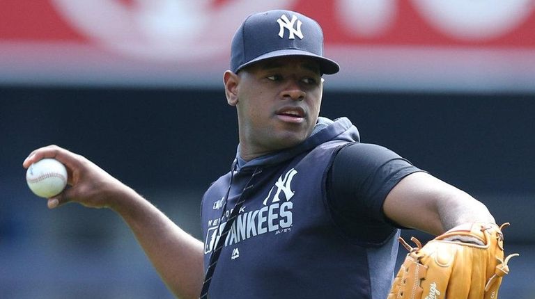 Yankees pitcher Luis Severino throws in the outfield