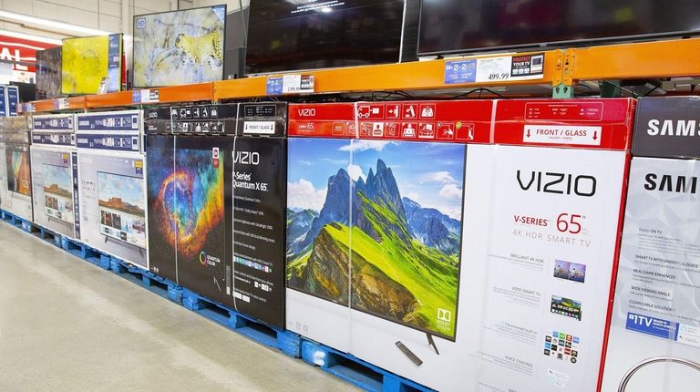 Large televisions on display at a Costco Club