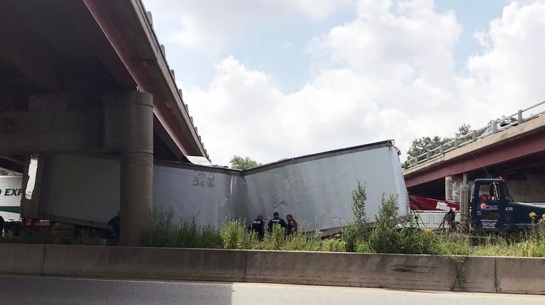 The tractor trailer under the overpass on Wednesday.