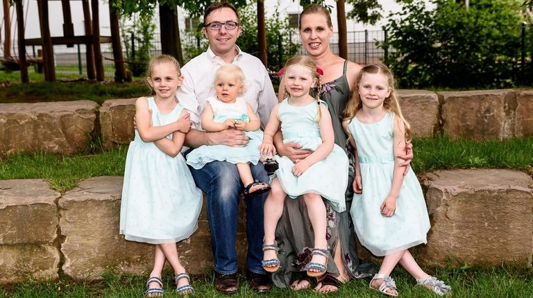 Jason Wagner, his wife, Marion Weiler, and daughters