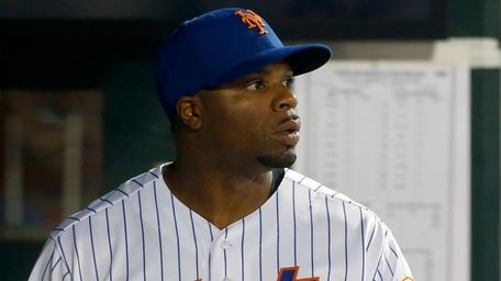 The Mets' Rajai Davis looks on during the