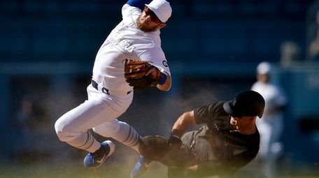 Los Angeles Dodgers second baseman Max Muncy falls
