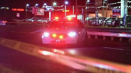 Suffolk County detectives at the scene of a