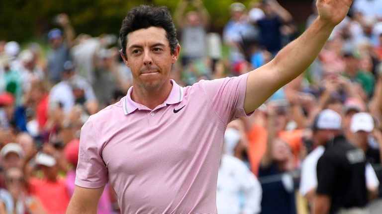 Rory McIlroy waves to the gallery after winning