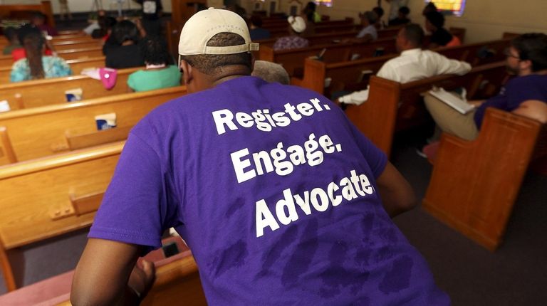 A man listens as Black Voters Matter co-founder