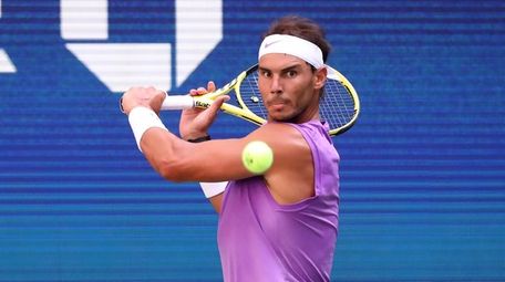 Rafael Nadal with the backhand return against Hyeon