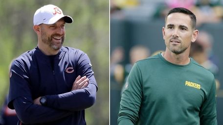 Bears head coach Matt Nagy, left, smiles during
