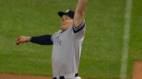 Yankees first baseman Luke Voit reaches for a