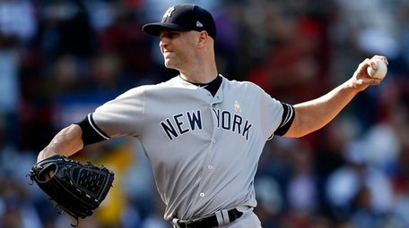 The Yankees' J.A. Happ pitches during the second
