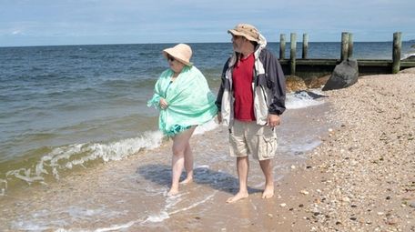 Elizabeth and Fred Rosenberg, of Aquebogue, walk along