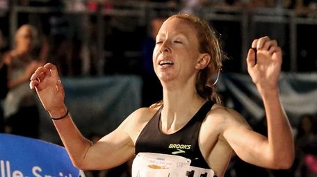 Amanda Eccleston breaks the tape in the women's