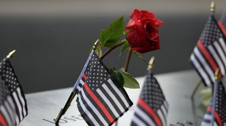 Flowers and flags left for those who died