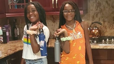 Twins Regan and Bria Baker, 10, of Islip,