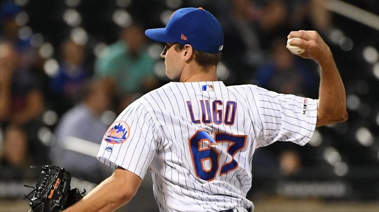 Mets relief pitcher Seth Lugo delivers against the