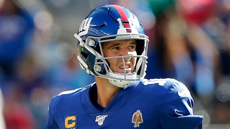 Eli Manning of the Giants looks on after