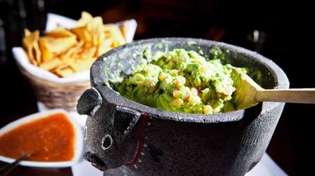 Guacamole is prepared table-side at Besito.