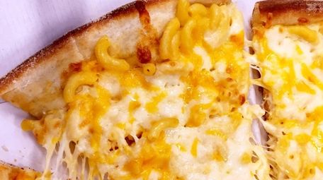 Macaroni and cheese pizza is served at Mario's