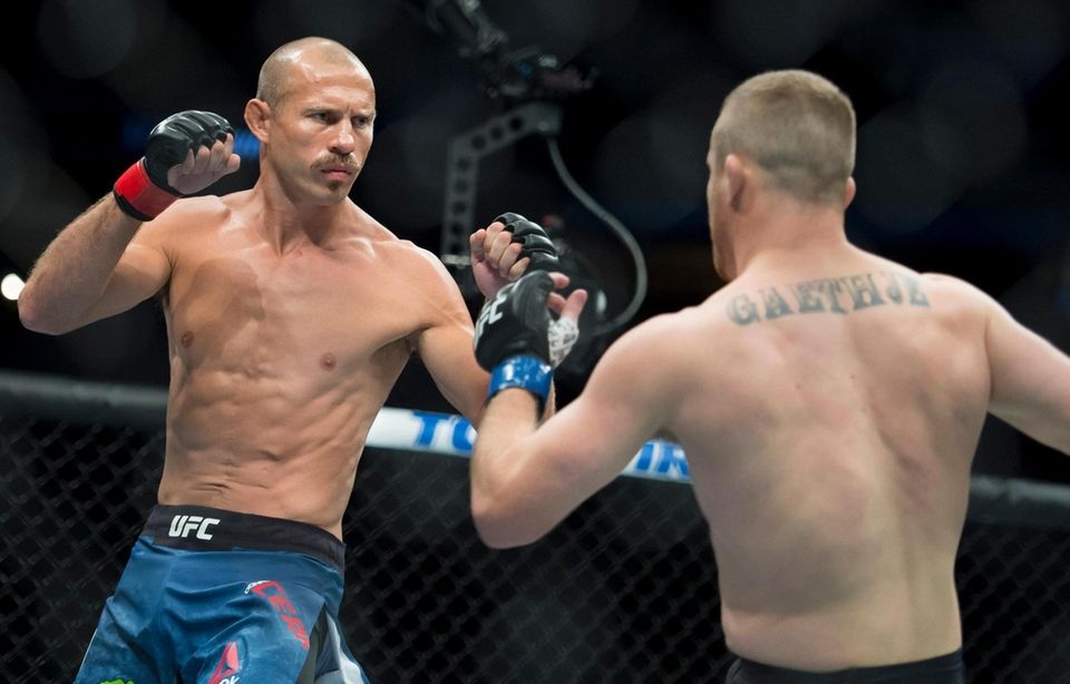 Donald "Cowboy" Cerrone, left, fights Justin Gaethje during