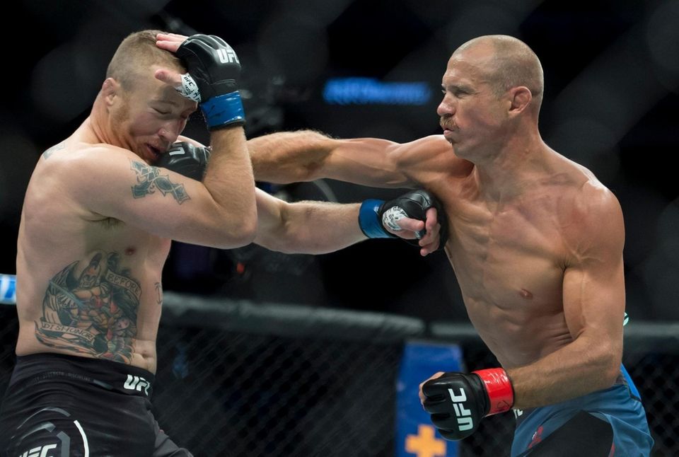 Donald "Cowboy" Cerrone, right, fights Justin Gaethje during