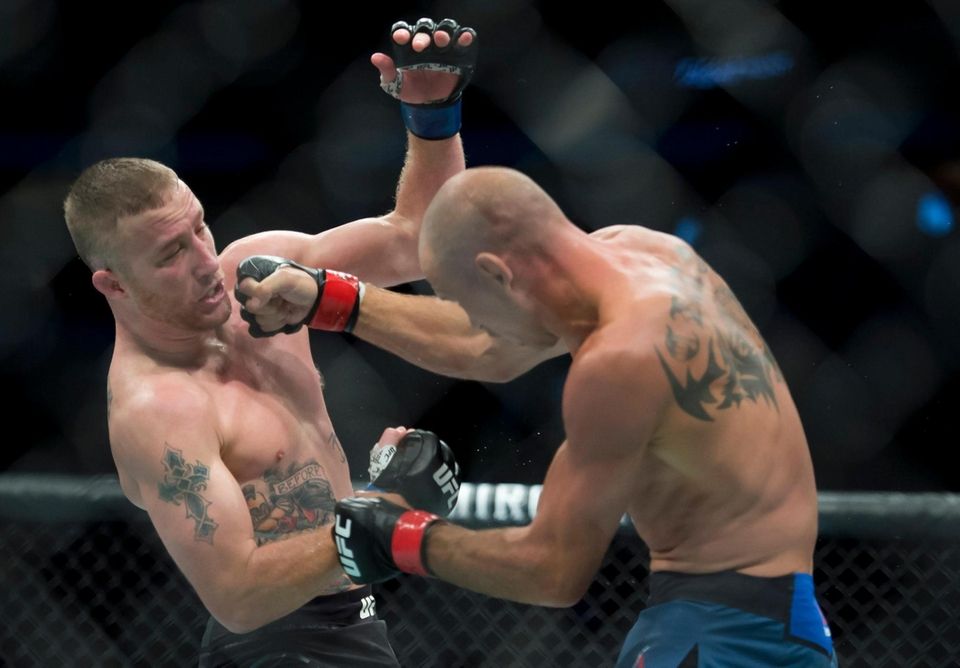 Donald "Cowboy" Cerrone, right, fights Justin Gaethje during
