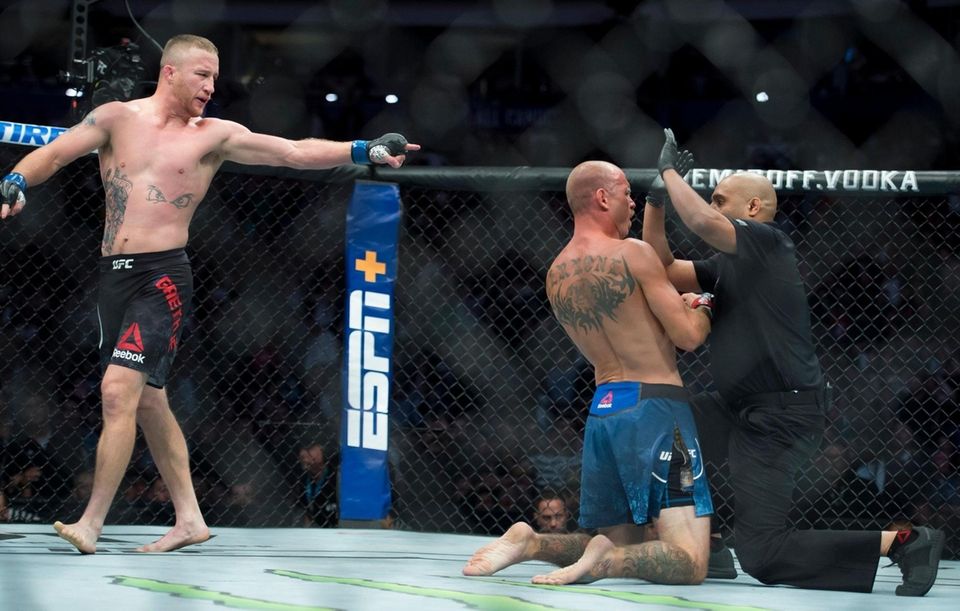 Justin Gaethje looks on as the referee checks