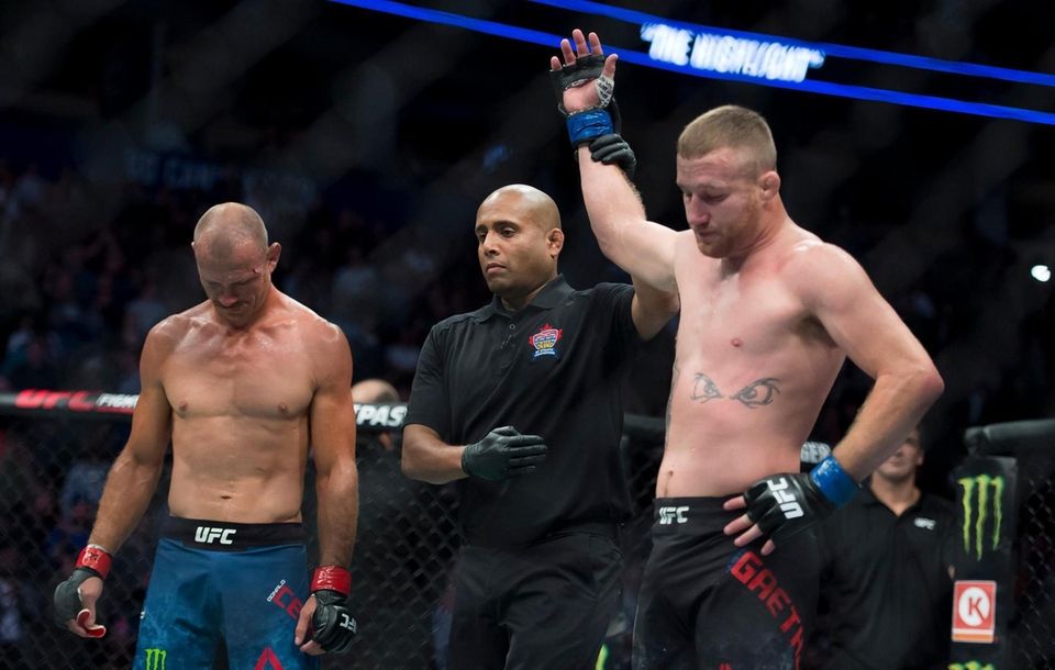 Justin Gaethje, right, celebrates his win over Donald